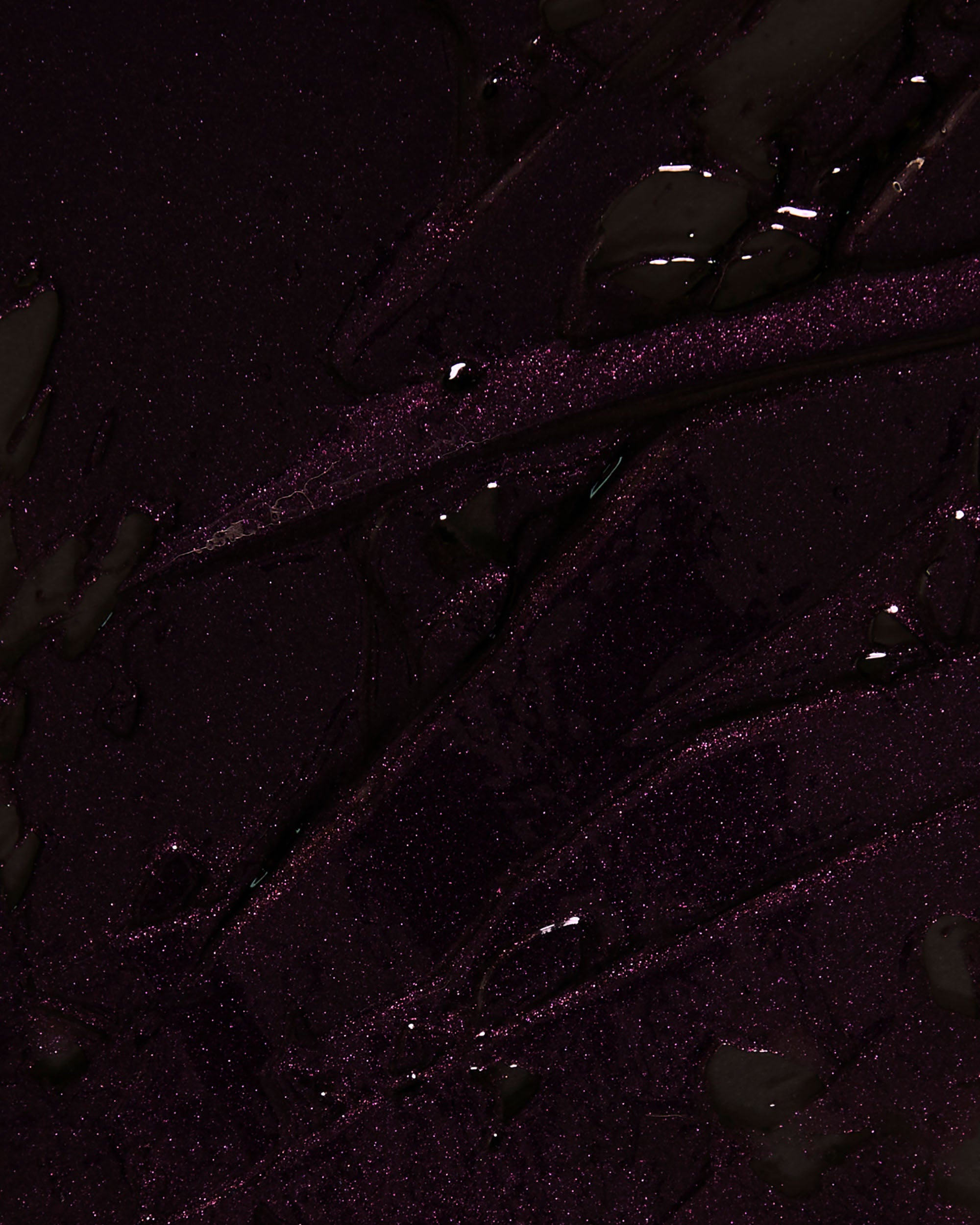 Close-up texture detail of Night Bloom Thorn Bite lip oil